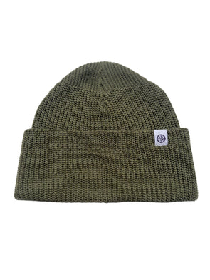 Green knit beanie with a logo tag on a white  background