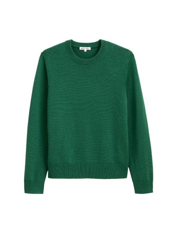 Green sweater on a light gray background